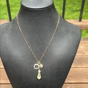 Vintage Monet Gold and Green Necklace with Rhinestones and Elegant Design